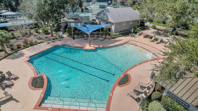 pool featuring a patio area and fence