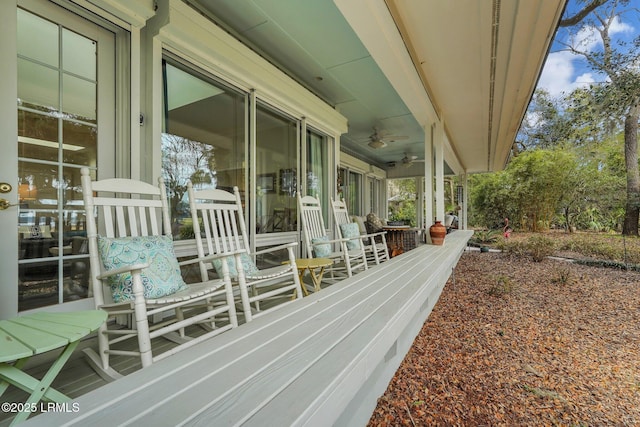 wooden terrace with ceiling fan