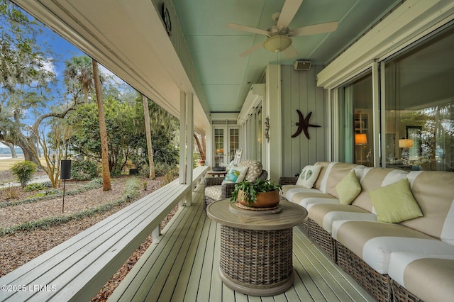 exterior space with ceiling fan and an outdoor hangout area