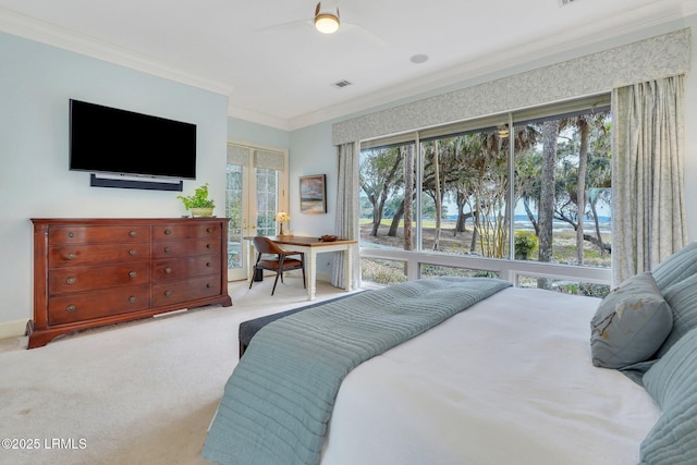 bedroom with crown molding, visible vents, light carpet, ceiling fan, and baseboards