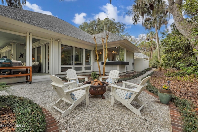 view of patio with an outdoor fire pit