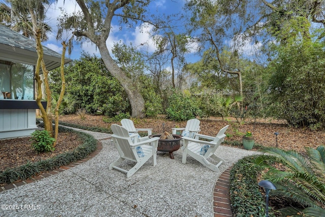 view of patio with an outdoor fire pit