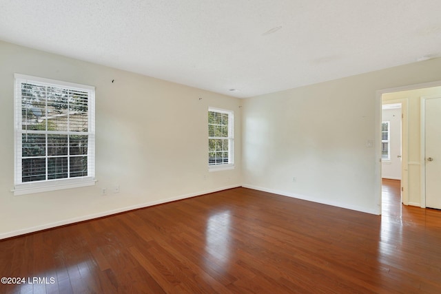 spare room featuring hardwood / wood-style flooring