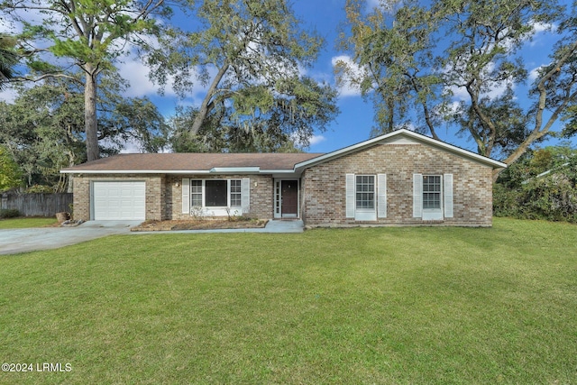 ranch-style house with a garage and a front lawn