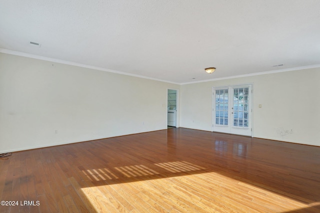 unfurnished room with hardwood / wood-style flooring and ornamental molding