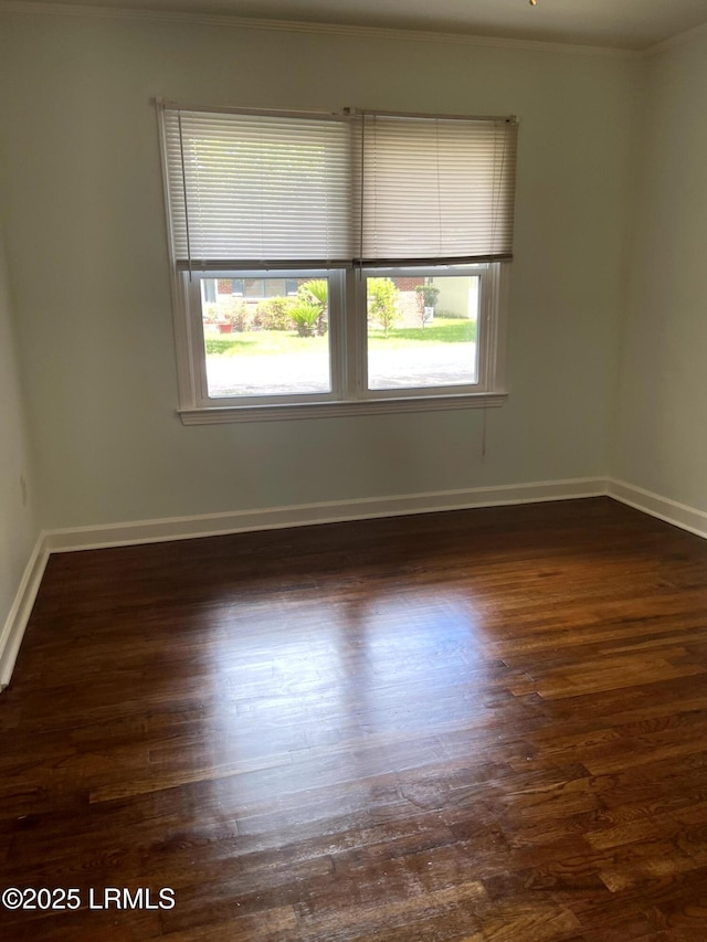 1806 6th St, Beaufort, SC 29902 - unfurnished room with plenty of natural light, crown molding, dark wood-style flooring, and baseboards