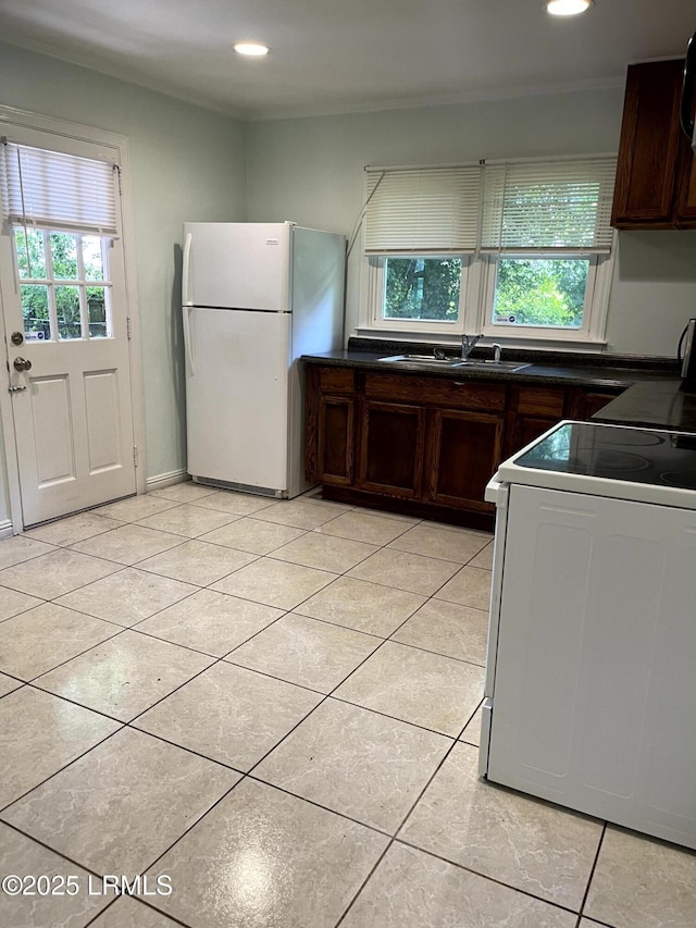 1806 6th St, Beaufort, SC 29902 - kitchen with stove, freestanding refrigerator, a sink, plenty of natural light, and recessed lighting