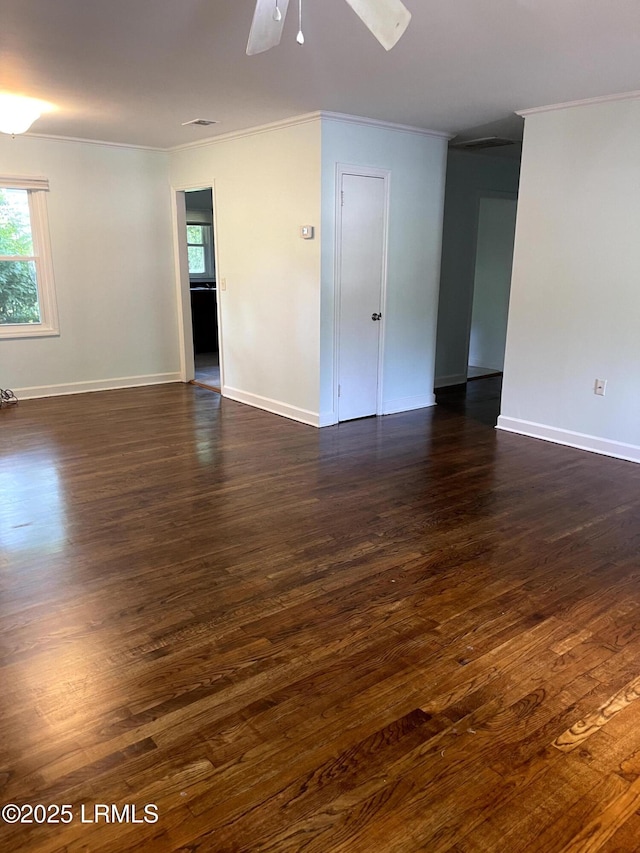 1806 6th St, Beaufort, SC 29902 - empty room featuring crown molding, dark wood finished floors, plenty of natural light, a ceiling fan, and baseboards