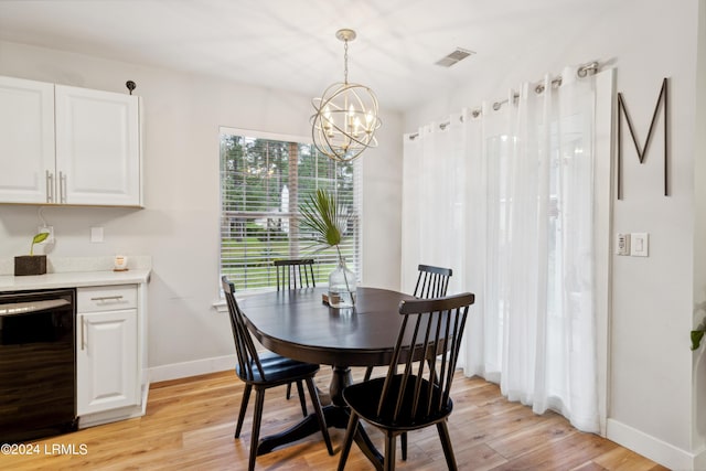 dining area featuring a chandelier and light wood-type flooring