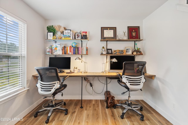 home office with hardwood / wood-style floors