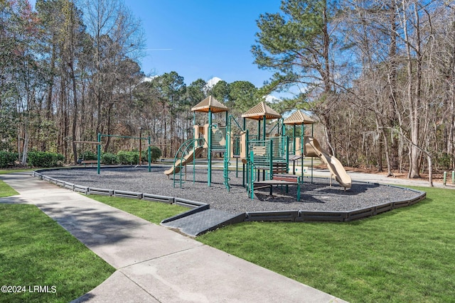 view of playground with a lawn