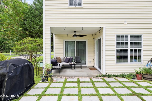 view of patio featuring grilling area, outdoor lounge area, and ceiling fan