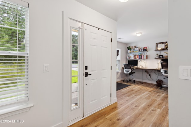 entryway with light hardwood / wood-style flooring