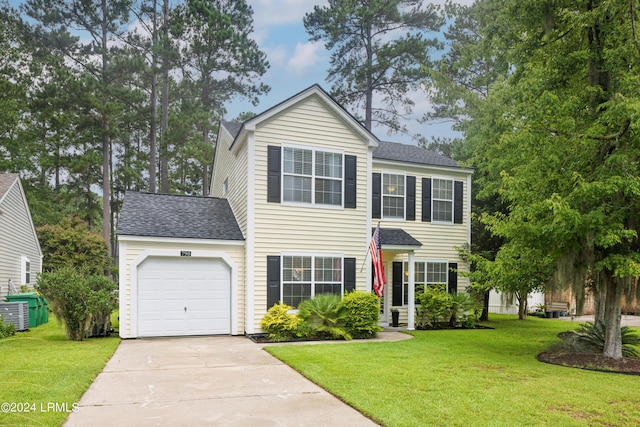 view of front of house featuring central AC unit, a garage, and a front yard