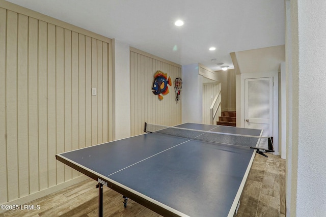 recreation room featuring wood finished floors and recessed lighting