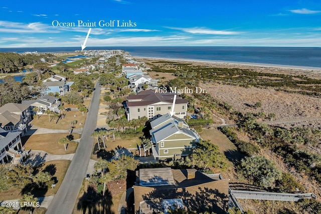 bird's eye view featuring a water view and a view of the beach