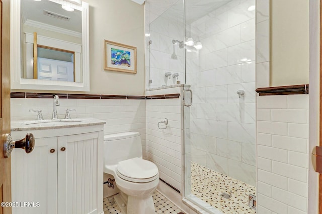 full bathroom with toilet, a stall shower, visible vents, and tile walls