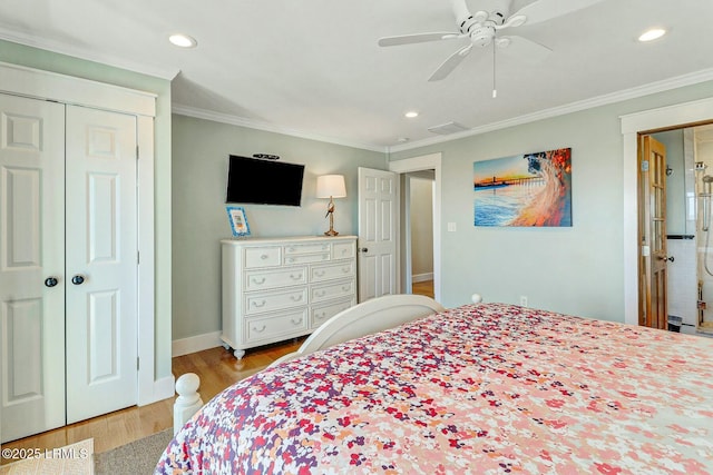 bedroom featuring recessed lighting, a closet, ornamental molding, wood finished floors, and baseboards