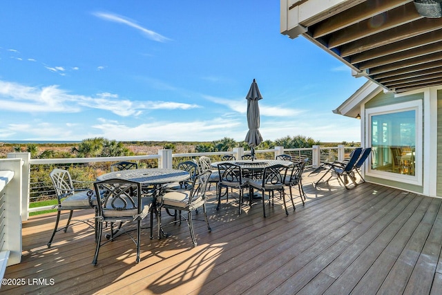 deck with outdoor dining area