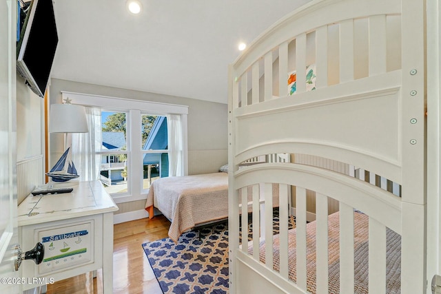 bedroom featuring light wood-style flooring