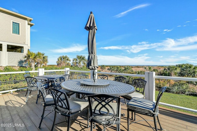 wooden deck featuring outdoor dining space