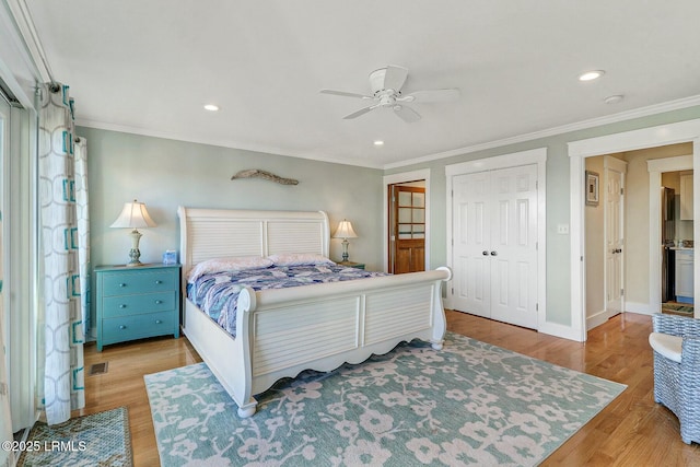 bedroom with baseboards, ornamental molding, wood finished floors, and recessed lighting