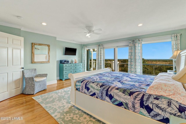 bedroom featuring baseboards, ornamental molding, wood finished floors, and recessed lighting