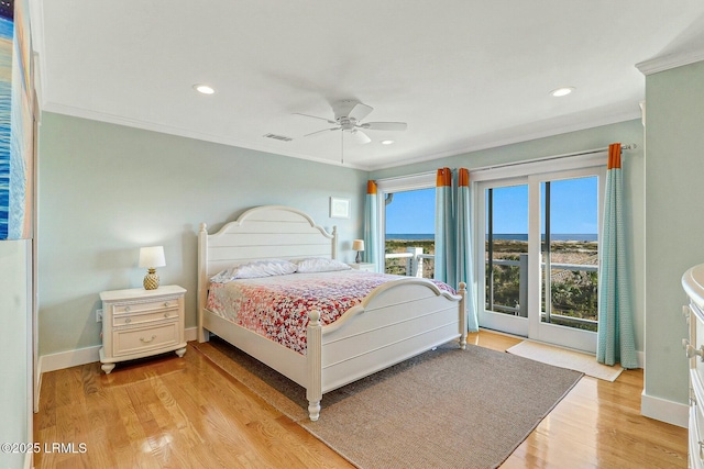 bedroom featuring ornamental molding, light wood-type flooring, baseboards, and recessed lighting