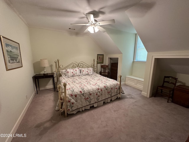 bedroom featuring ceiling fan, ornamental molding, carpet flooring, and vaulted ceiling