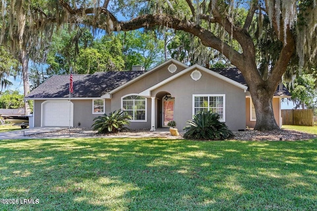 ranch-style house with a garage and a front yard