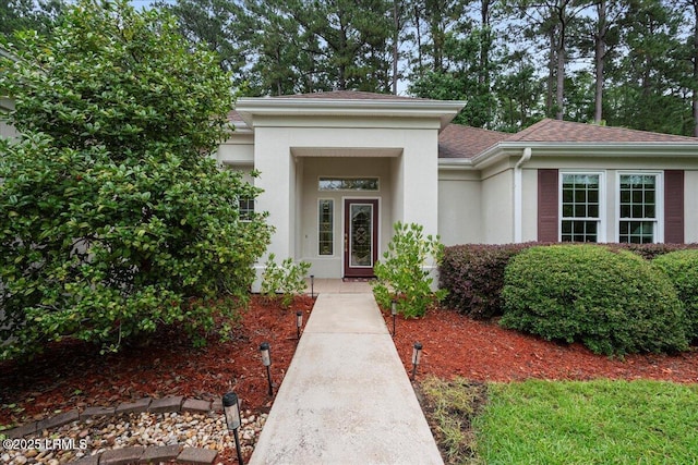 10 Screven Ct, Bluffton, SC 29909 - doorway to property with stucco siding and roof with shingles