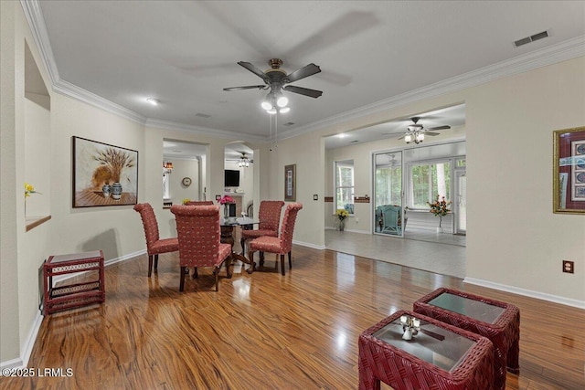 10 Screven Ct, Bluffton, SC 29909 - dining area featuring a ceiling fan, wood finished floors, baseboards, and crown molding