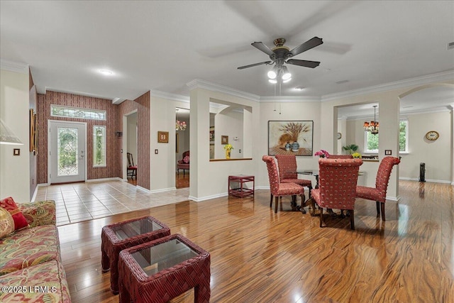 10 Screven Ct, Bluffton, SC 29909 - living area with plenty of natural light, wood finished floors, arched walkways, crown molding, and a ceiling fan