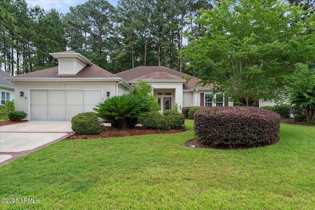 10 Screven Ct, Bluffton, SC 29909 - ranch-style house featuring a garage, concrete driveway, a front yard, and stucco siding