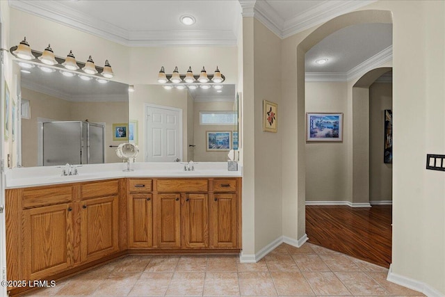 10 Screven Ct, Bluffton, SC 29909 - bathroom with a shower stall, double vanity, ornamental molding, tile patterned floors, and baseboards