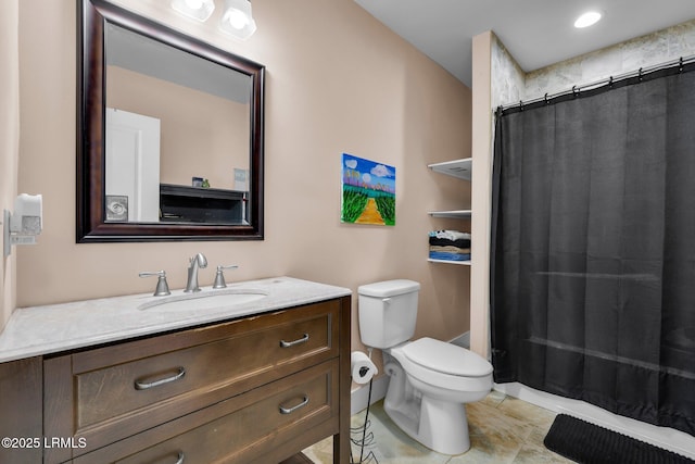 bathroom featuring vanity, a shower with shower curtain, and toilet