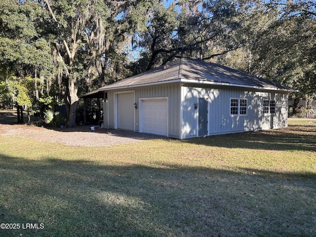 garage featuring a lawn