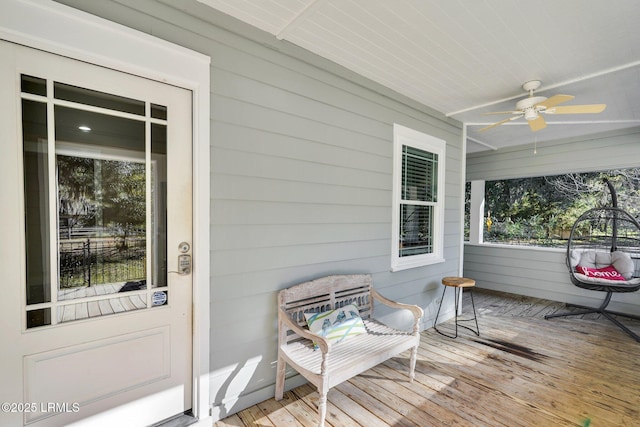 exterior space featuring ceiling fan