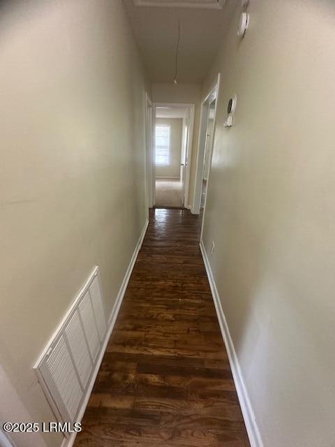 1006 Duke St, Beaufort, SC 29902 - hallway with dark wood-type flooring, attic access, baseboards, and visible vents