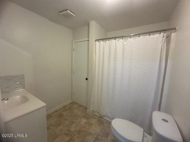 1006 Duke St, Beaufort, SC 29902 - full bathroom featuring toilet, visible vents, a shower with shower curtain, and vanity