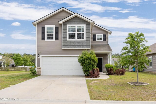 23 Toxaway Ln, Beaufort, SC 29906 - view of front of property with concrete driveway, an attached garage, fence, and a front yard