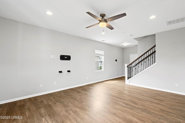 23 Toxaway Ln, Beaufort, SC 29906 - unfurnished living room featuring stairway, ceiling fan, baseboards, and visible vents