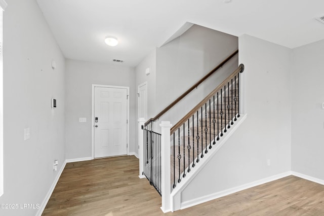 23 Toxaway Ln, Beaufort, SC 29906 - entrance foyer with wood finished floors, visible vents, and baseboards