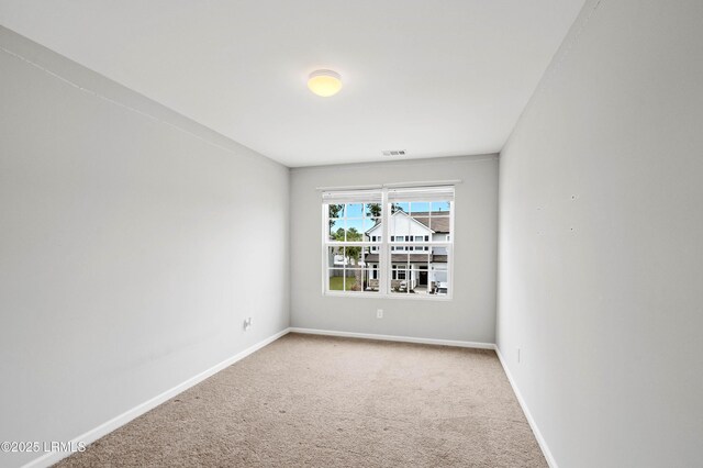 23 Toxaway Ln, Beaufort, SC 29906 - unfurnished room featuring baseboards, visible vents, and carpet floors