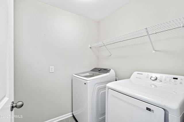 23 Toxaway Ln, Beaufort, SC 29906 - laundry room with washing machine and dryer, baseboards, and laundry area