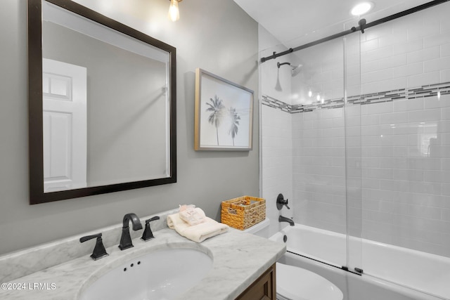 full bathroom featuring enclosed tub / shower combo, vanity, and toilet