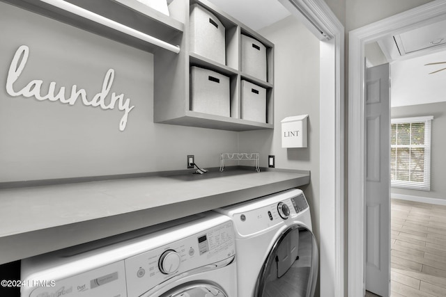 laundry area with washing machine and dryer