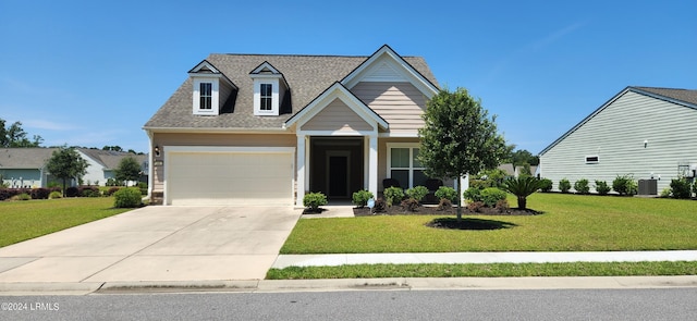 view of front of home featuring a garage, central AC, and a front yard