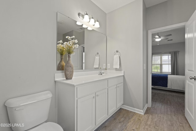 64 Grovewood Dr, Bluffton, SC 29910 - bathroom with ensuite bathroom, vanity, wood finished floors, toilet, and ceiling fan
