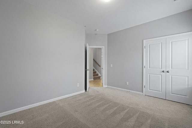 64 Grovewood Dr, Bluffton, SC 29910 - unfurnished bedroom featuring light carpet, baseboards, and a closet